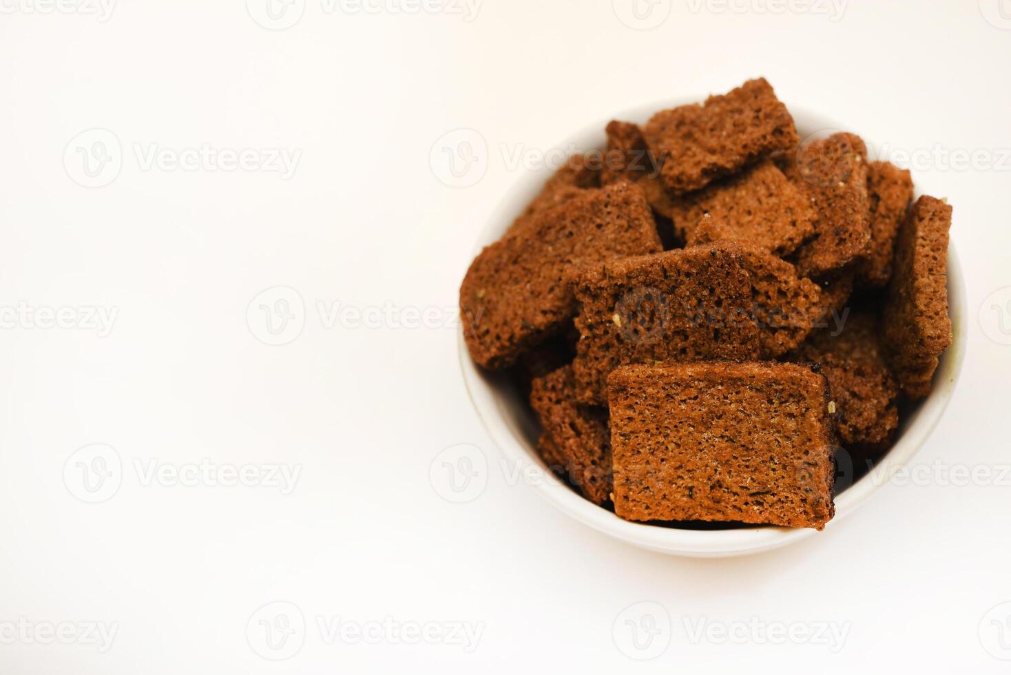 Spicy and salty crackers in cups. Food and snacks.Bread snacks. photo