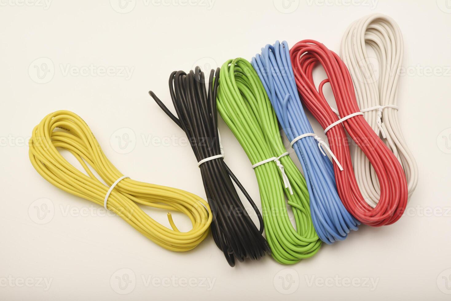 Multicolored jumper wires for breadboards. Coils of multicolored wires. Connecting wires for electronics. photo