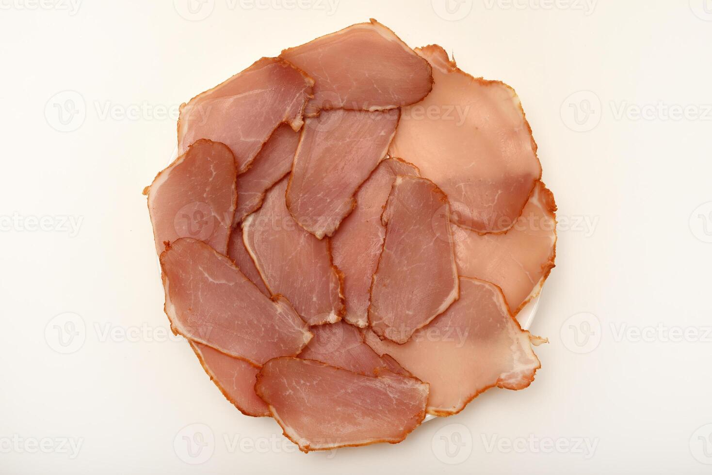 Ham cut into thin slices. Baguette with thinly sliced chicken and pesto photo