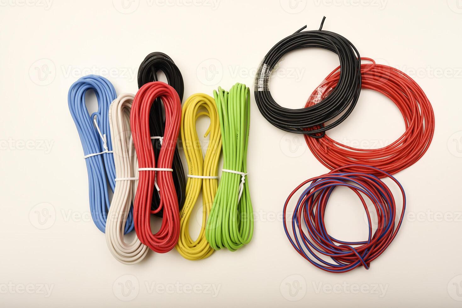 Color-coded wiring for PCB assembly. Coils of multicolored wires. Connecting wires for electronics. photo