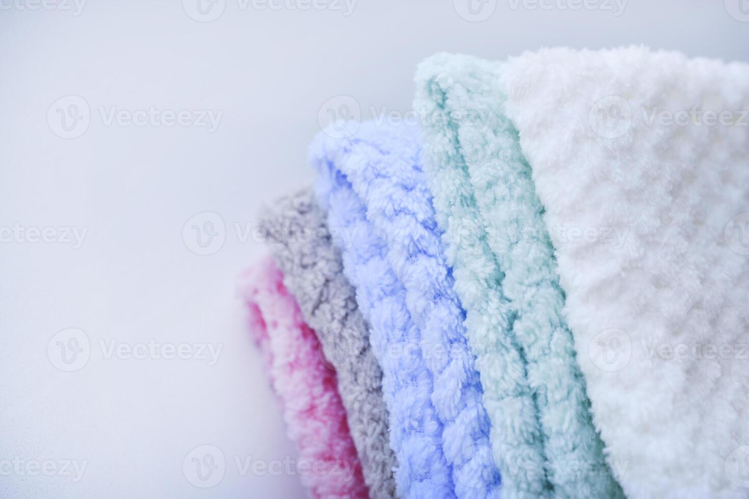 Soft pastel towels neatly arranged. Multi-colored pile towels. A soft towel. photo