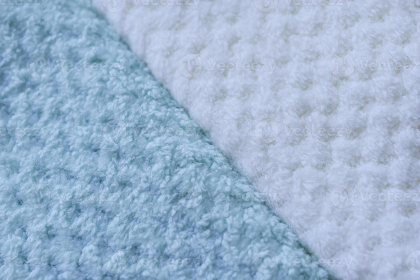 Color-blocked towel display. Background of colorful towels. Several soft terry towels. photo