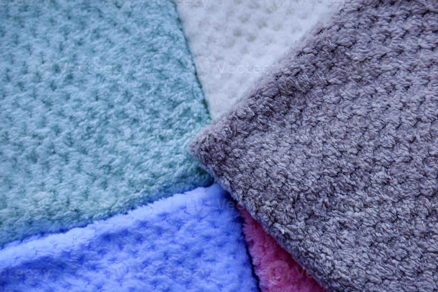 Rainbow-colored towels flat lay. Multi-colored pile towels. A soft towel. photo