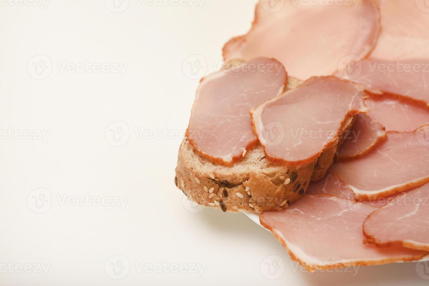 Ham sandwiches. Ham cut into thin slices. Open-faced sandwich with rare roast beef photo