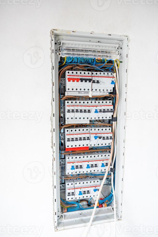 Open Electrical Panel with Circuit Breakers and Color Coded Wiring photo