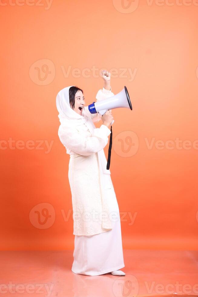 Confident proclamation, Empowered woman with megaphone spreading photo