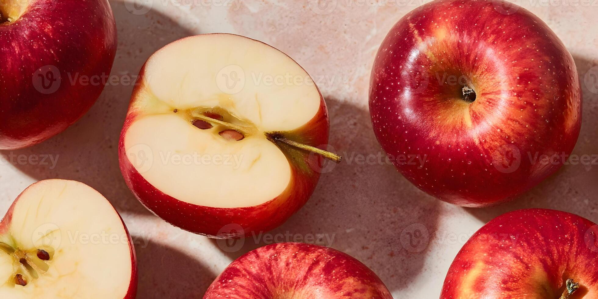 Red Apples Halved and Whole on Pink Surface Fresh Fruit Food Photography photo