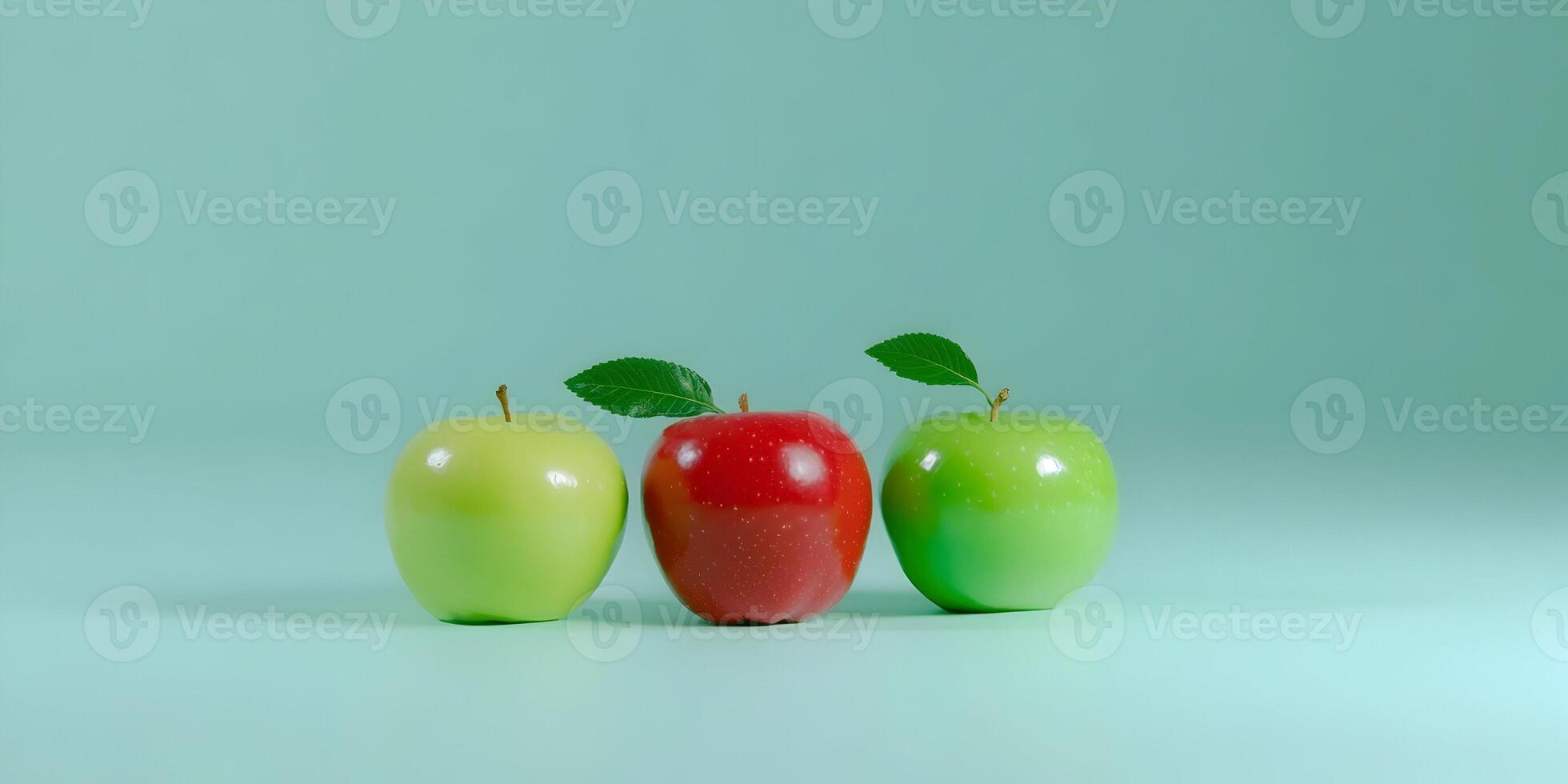 three apples are arranged in a row on a green surface photo
