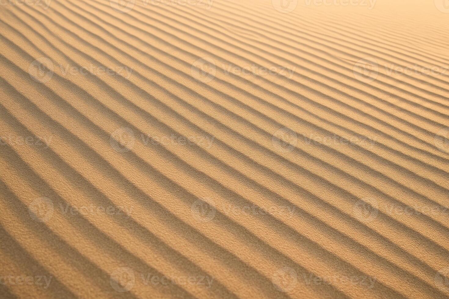 Close up of finely combed sand on a desert dune with distinct parallel wind patterns photo