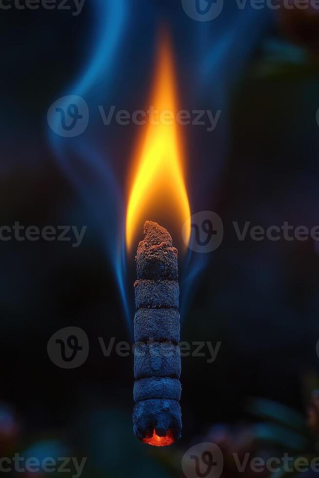 Burning rope with blue smoke creating a magical atmosphere photo