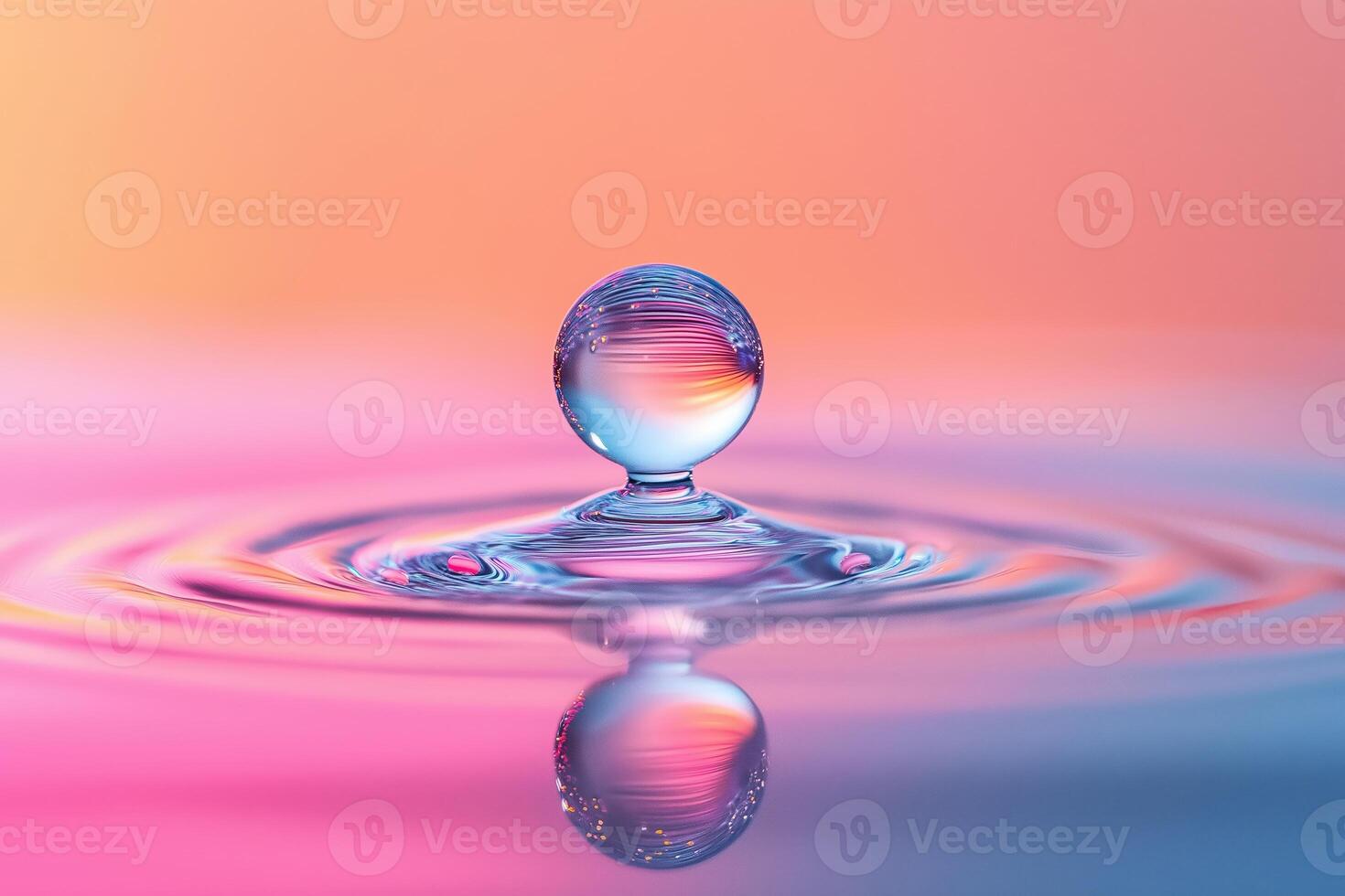 Water drop creating colorful ripples and reflections photo