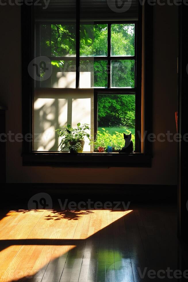 Black cat sitting on window sill enjoying sunlight and garden view photo