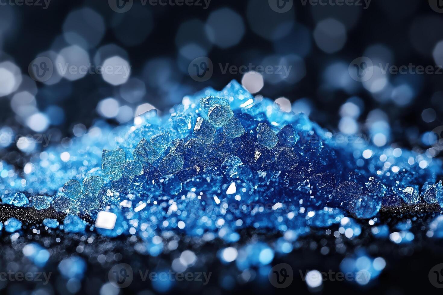 Pile of blue crystals forming an abstract background with bokeh photo