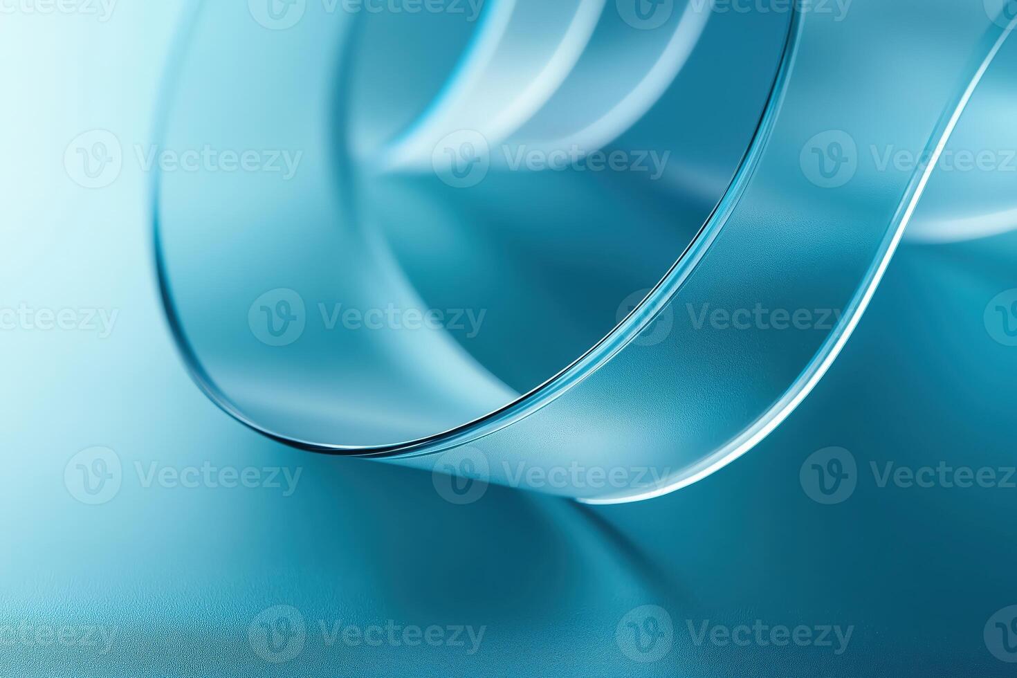 Abstract cyan glass ribbon gently curving and reflecting light photo