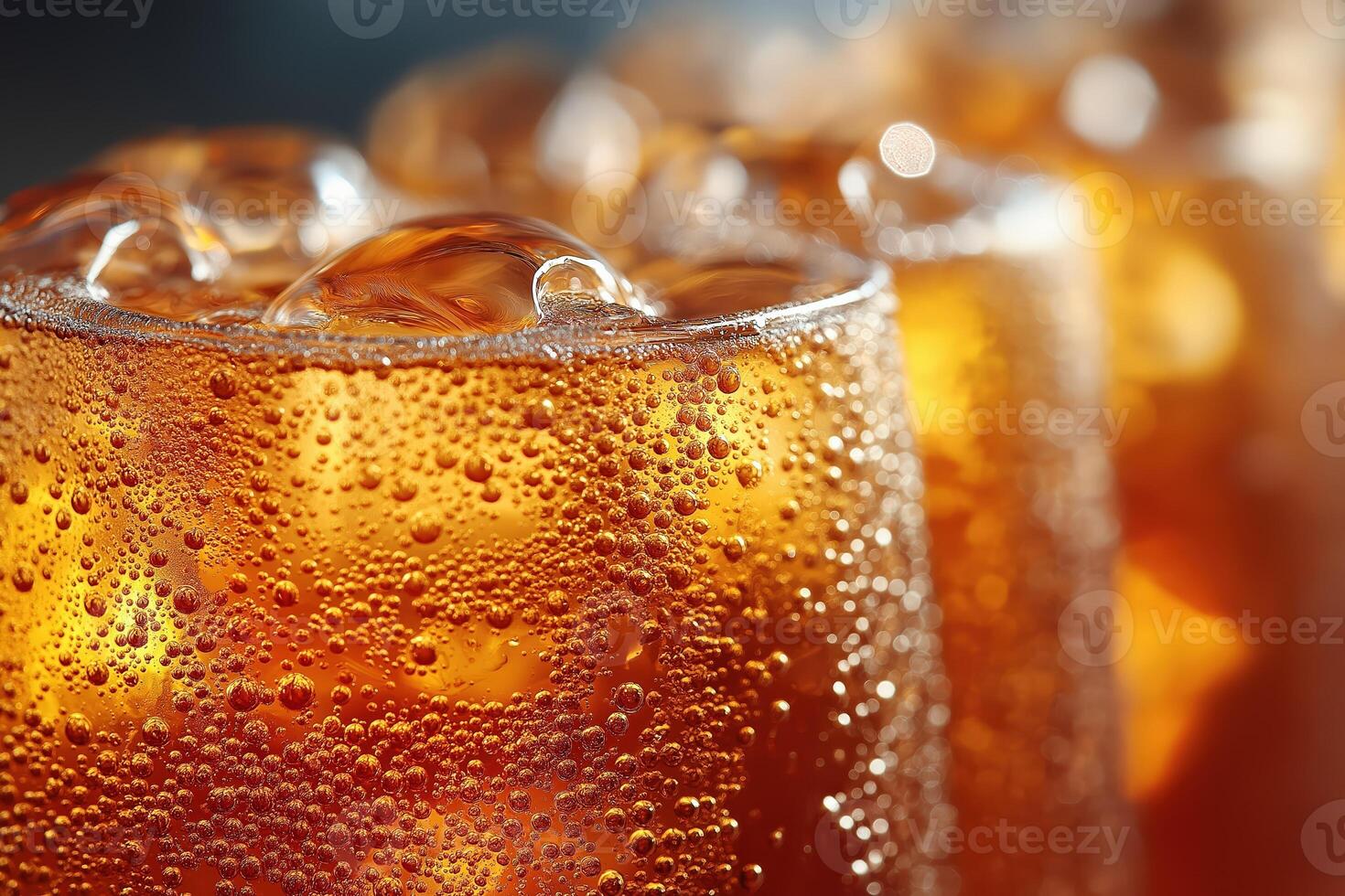 Refreshing iced tea with ice cubes and condensation forming on glass photo