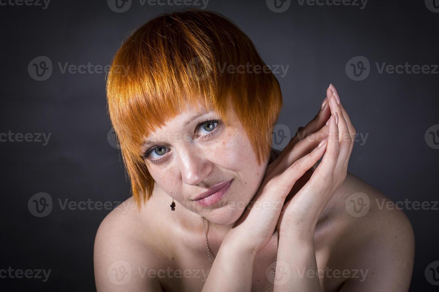 moscow, russia, 14.06.2017 A woman with red hair and a short haircut is posing for a picture photo