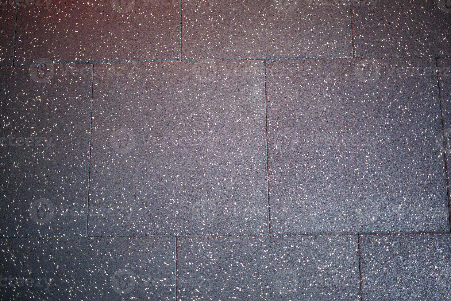 A CloseUp View of Beautifully Textured Roof Shingles That Feature a Sparkling and Shiny Finish photo