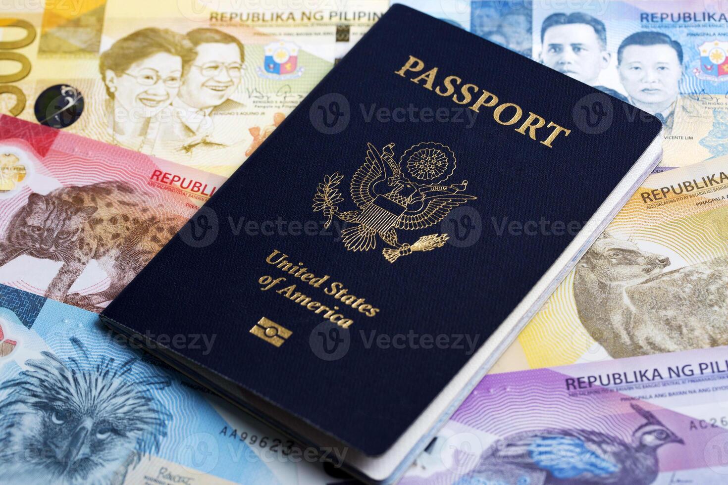 American passport on Philippine peso photo