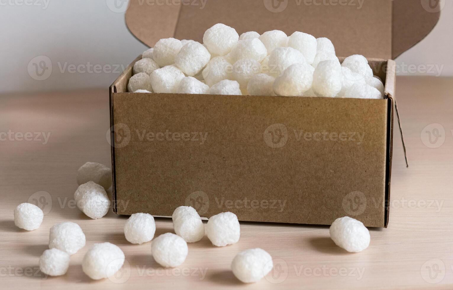 cardboard box filled with biodegradable packing peanuts from corn starch, eco-friendly filler modern shipping practices focused on reducing plastic waste , protecting fragile items during transport photo