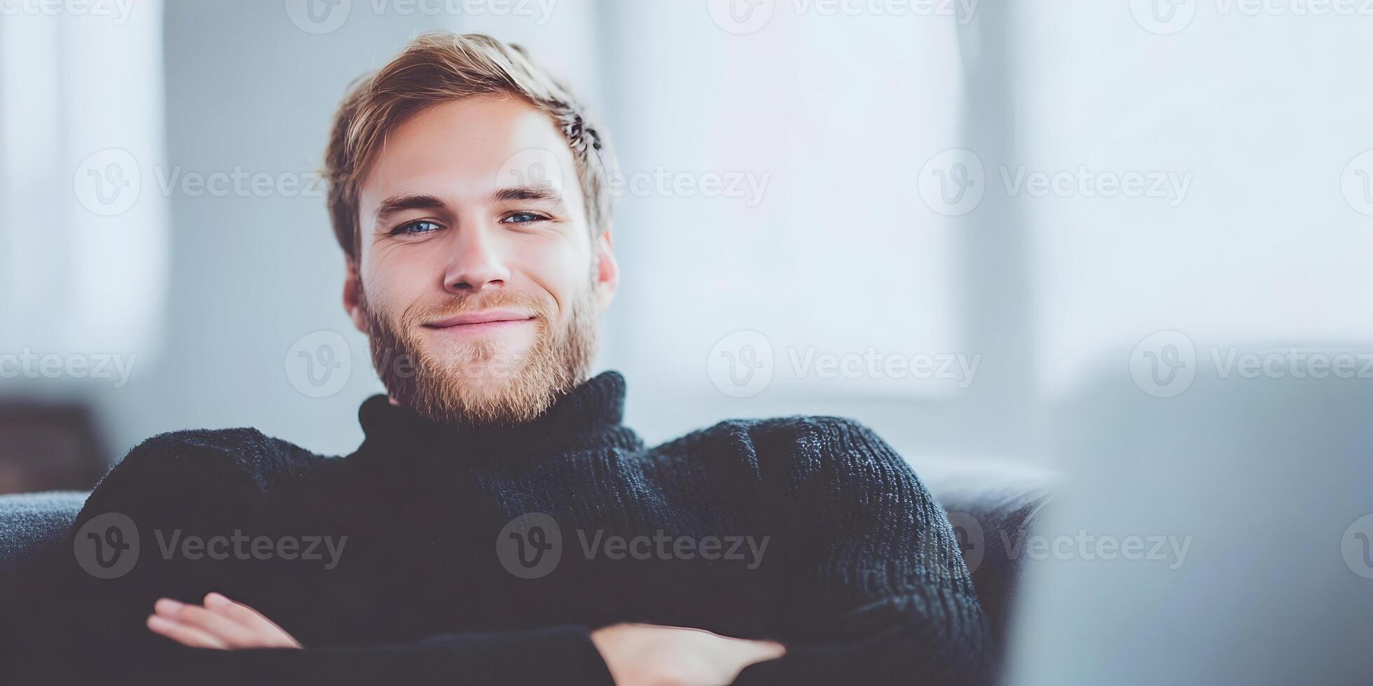 Smiling Young Man with Blond Hair Wearing Black Turtleneck Sweater photo