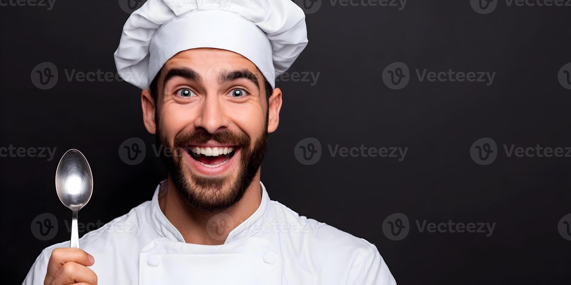 Happy Male Chef in White Uniform Holding Spoon Black Background photo