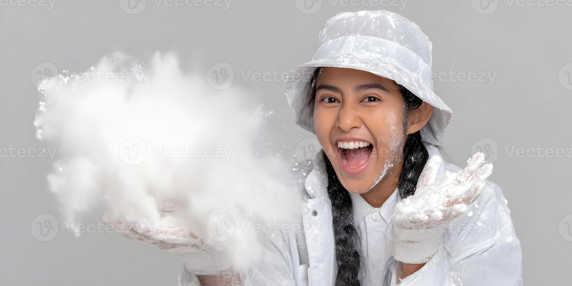 Happy Woman Playing with White Powder Wearing White Hat and Coat photo