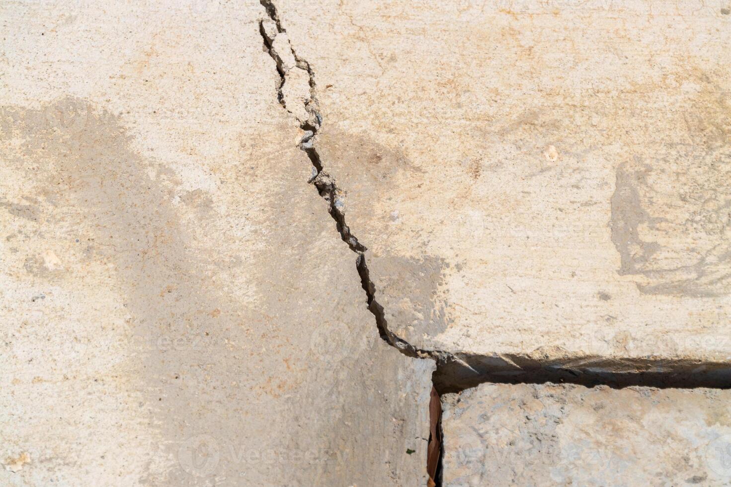 Crack formation in concrete slab urban area close-up structural integrity damage assessment photo