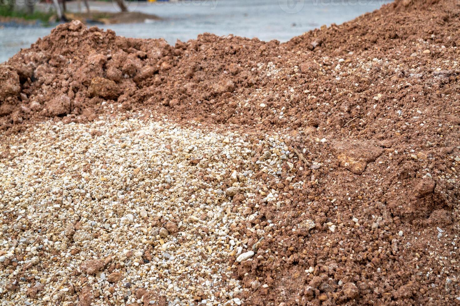 Showcasing construction materials dirt and gravel piles in a natural building environment photo