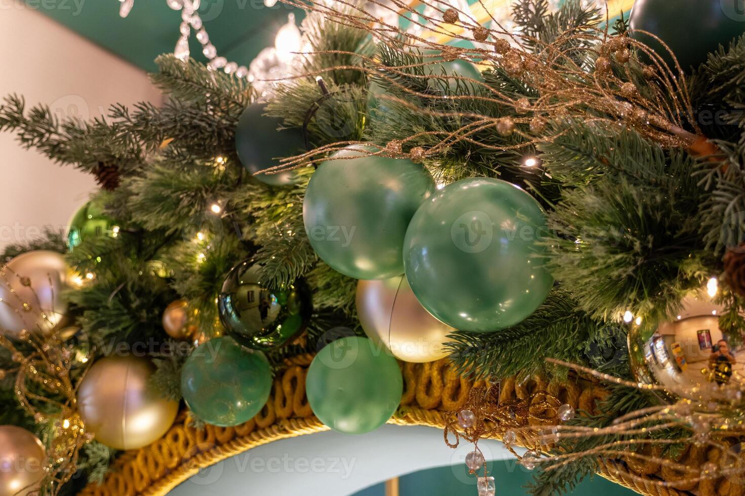 Festive holiday decor with green and gold ornaments indoor setting decorative imagery cozy atmosphere close-up perspective seasonal celebration photo