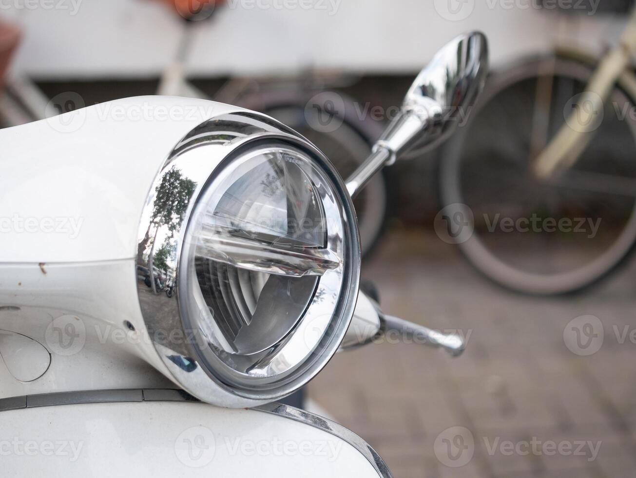 Vintage motorcycle close-up urban setting photography street environment detailed view classic transport aesthetics photo