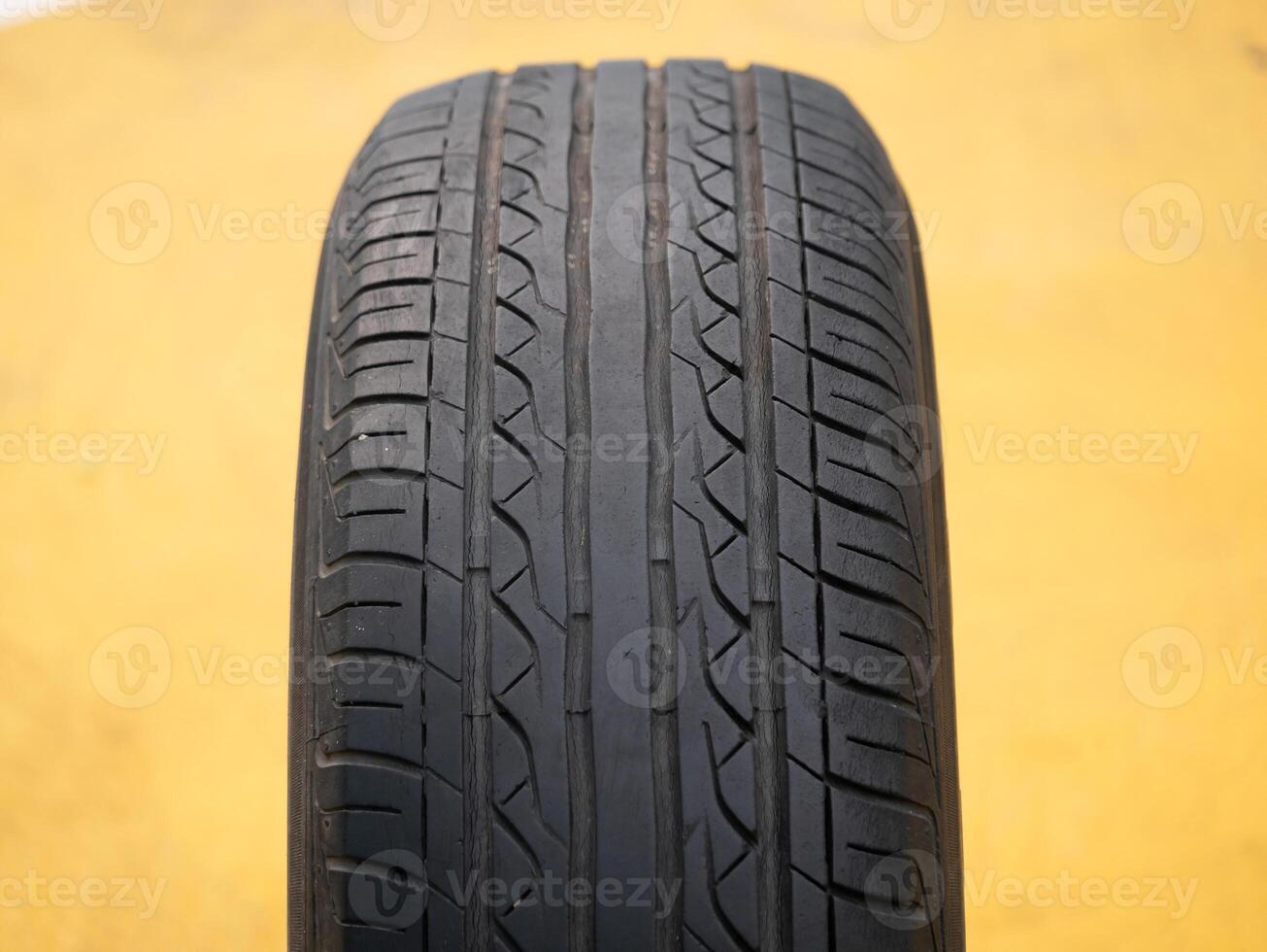 Inspecting tire quality automotive workshop product photography industrial setting close-up safety awareness photo