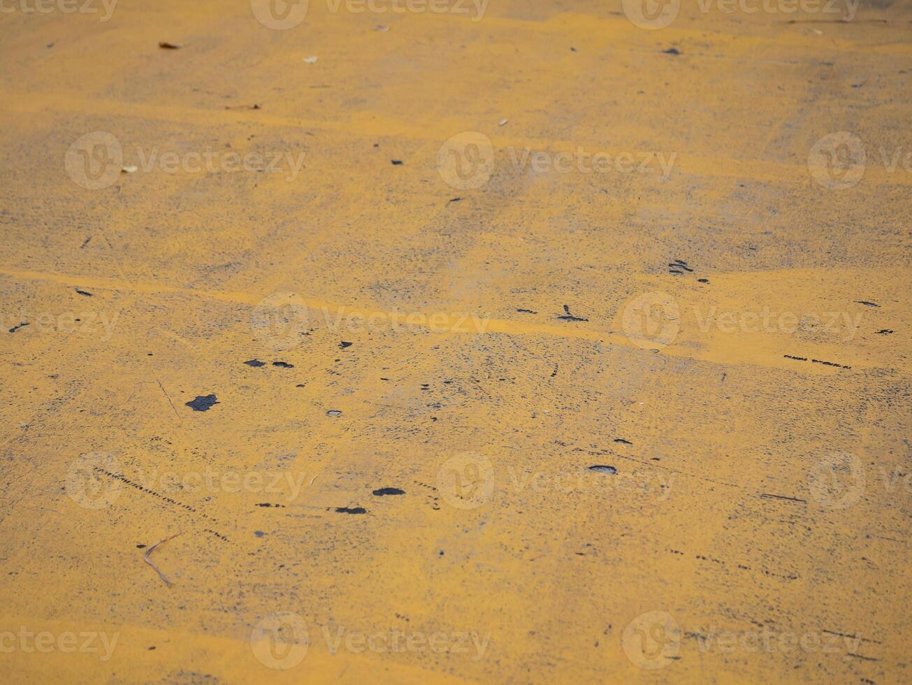 Yellow concrete surface patterns urban environment artistic close-up industrial area top-down perspective abstract concept photo