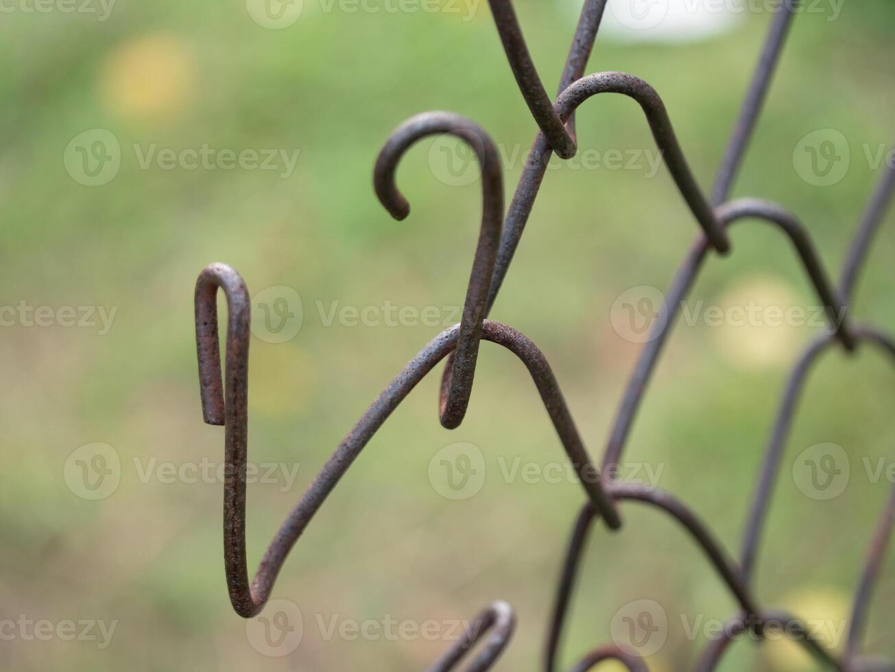 Close-up view of wire fence hooks outdoor setting nature photography detailed perspective abstract concept for art photo
