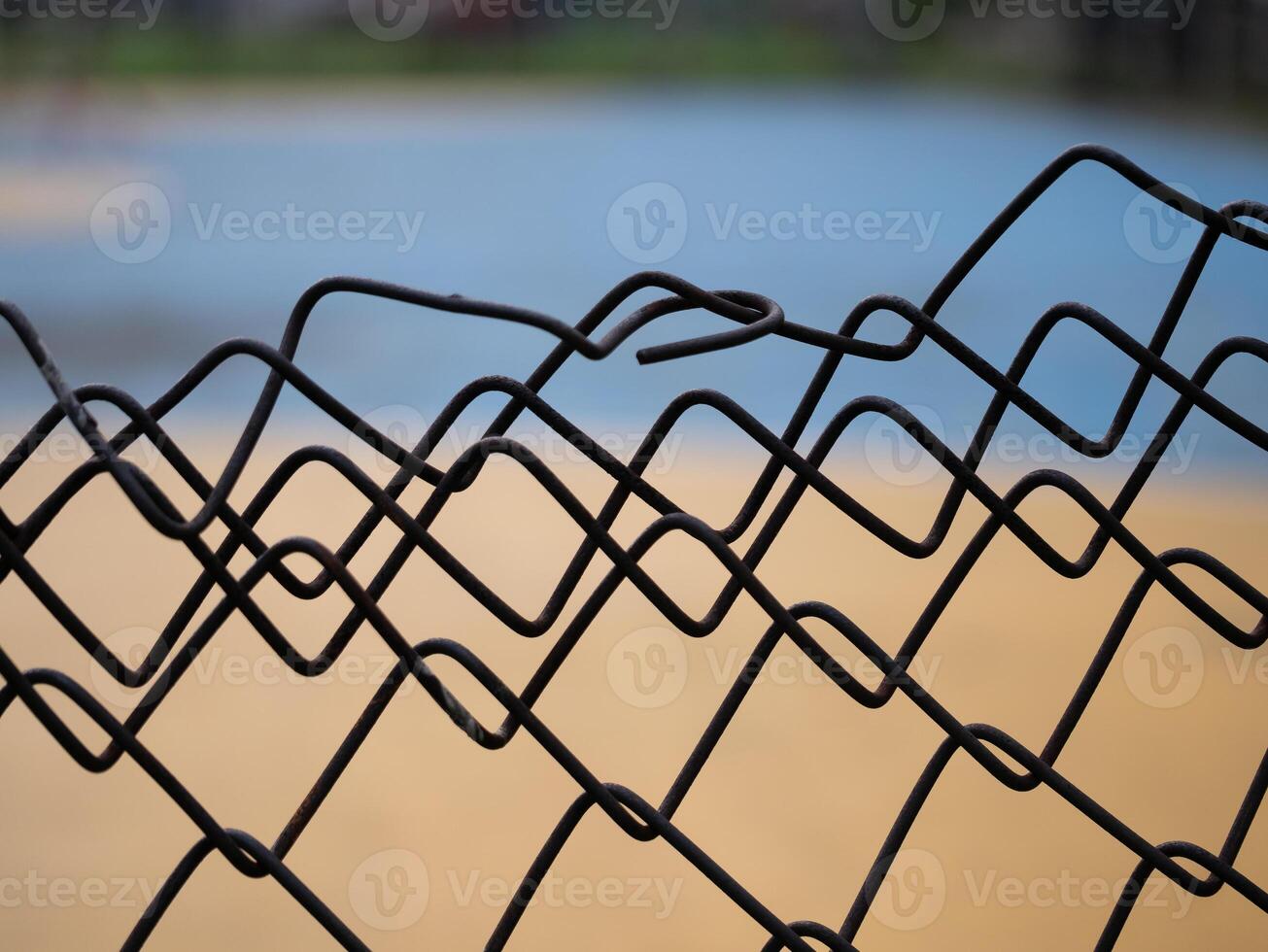 Wavy metal fence outdoor park close-up photography natural light abstract viewpoint artistic perspective photo