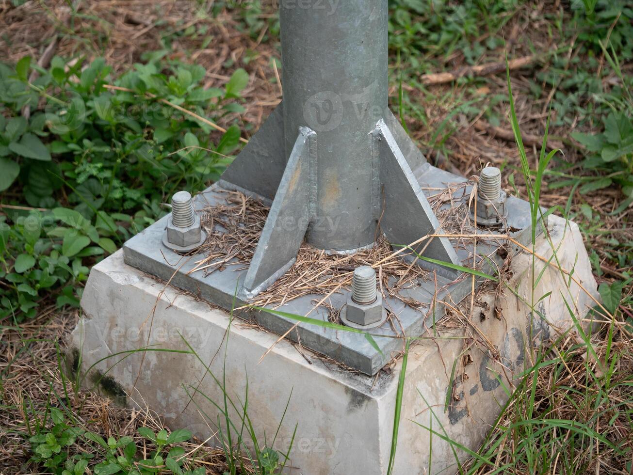 Installation of metal pole base outdoor site infrastructure image natural environment ground level engineering concept photo