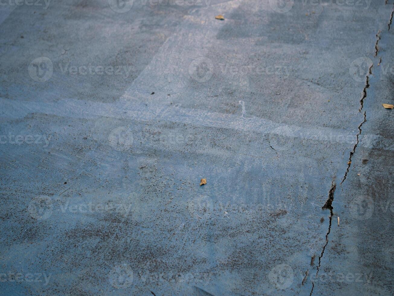 Cracked concrete surface urban area texture photography industrial environment close-up view urban decay concept photo