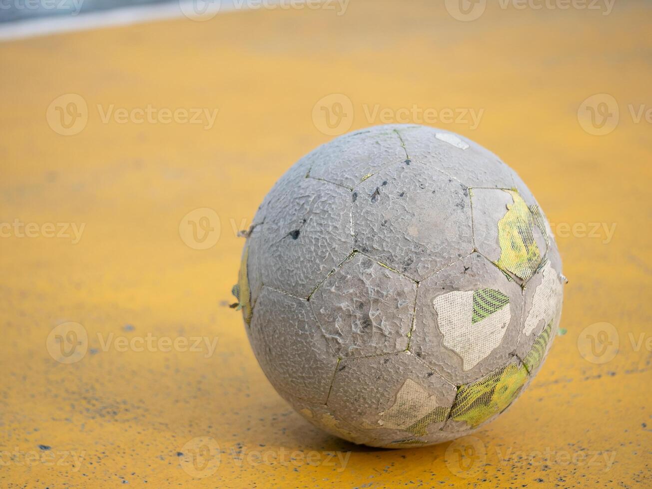 Soccer ball rolling on court urban playground sports photography outdoor environment close-up view action and motion photo
