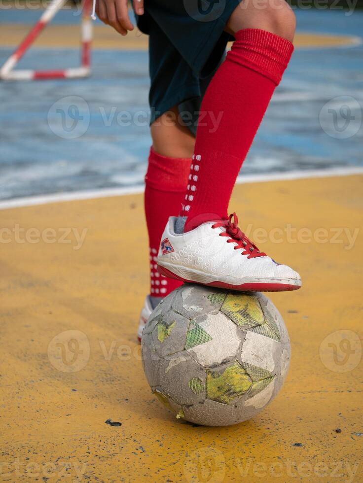 Youth soccer practice urban playground action shot colorful environment close-up perspective team spirit in motion photo