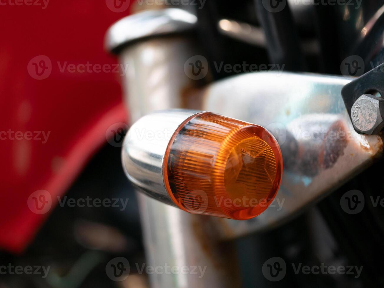 Motorcycle signal light action garage setting close-up image industrial environment detailed view vehicle safety concept photo
