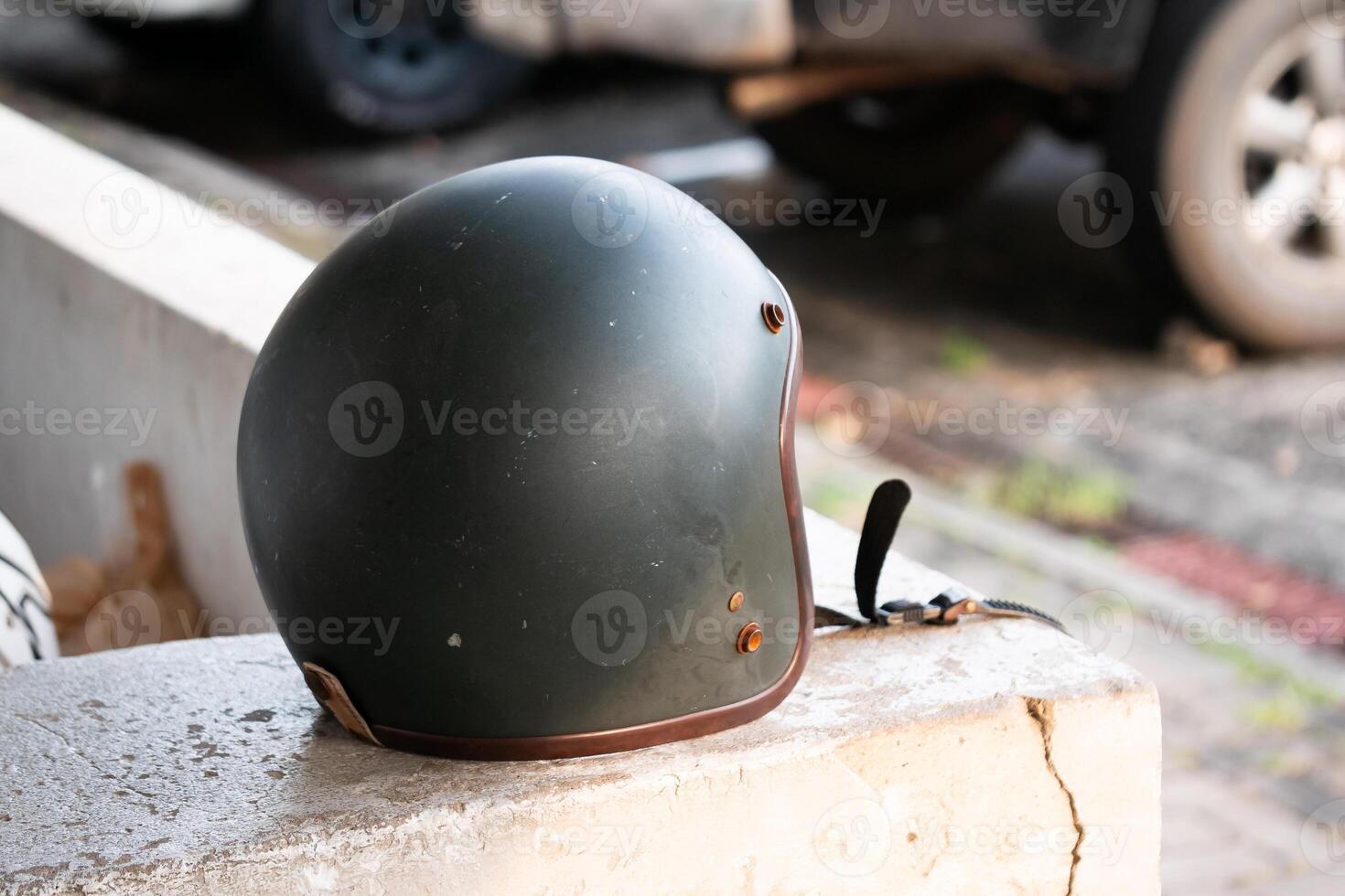Motorcycle helmet on urban street safety gear outdoor environment close-up perspective urban lifestyle insights photo