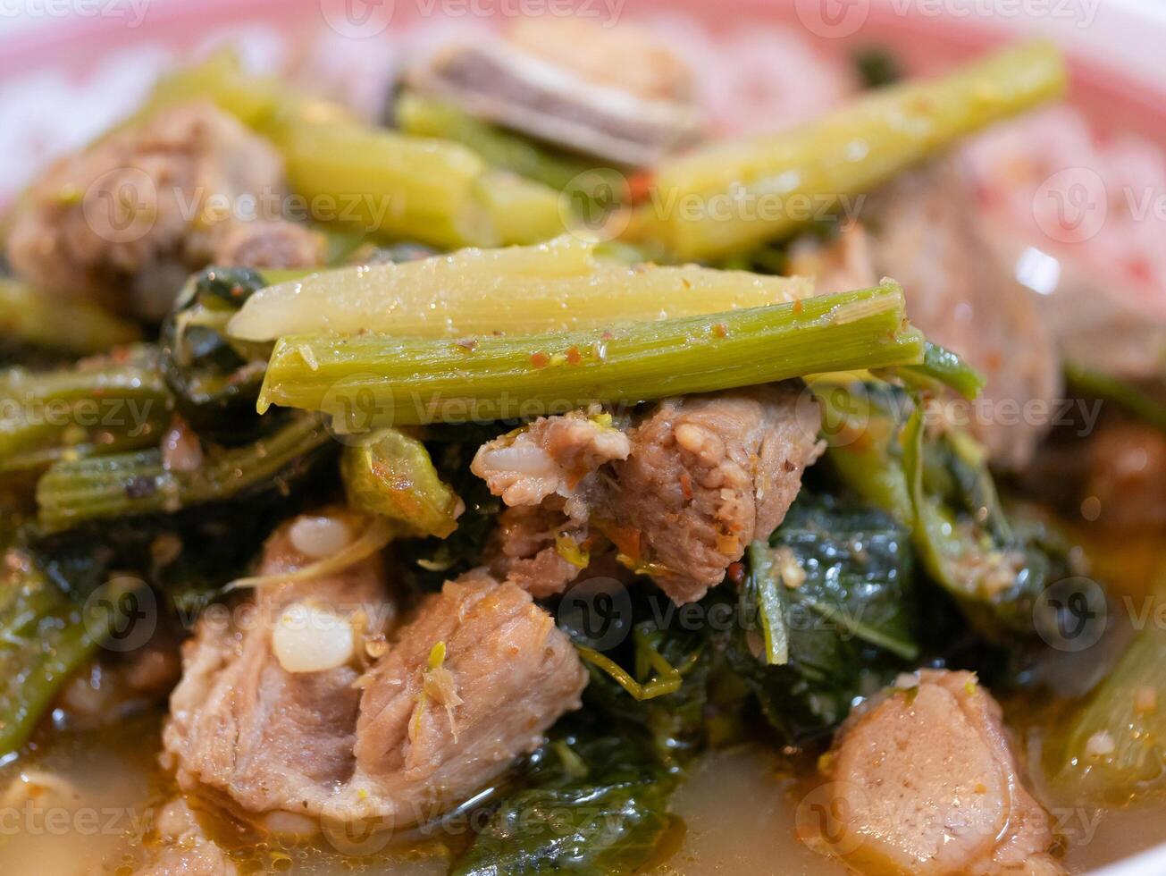 Cooking traditional meat and vegetable dish home kitchen food preparation cozy atmosphere close-up view culinary artistry photo