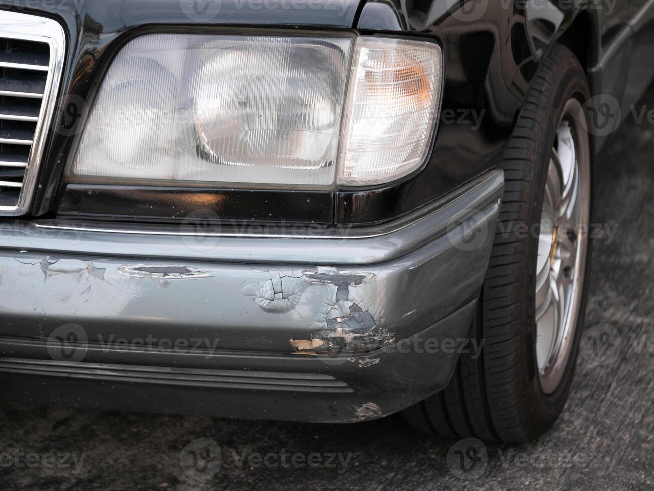Car damage assessment urban area photograph close-up view automotive care vehicle maintenance insights photo