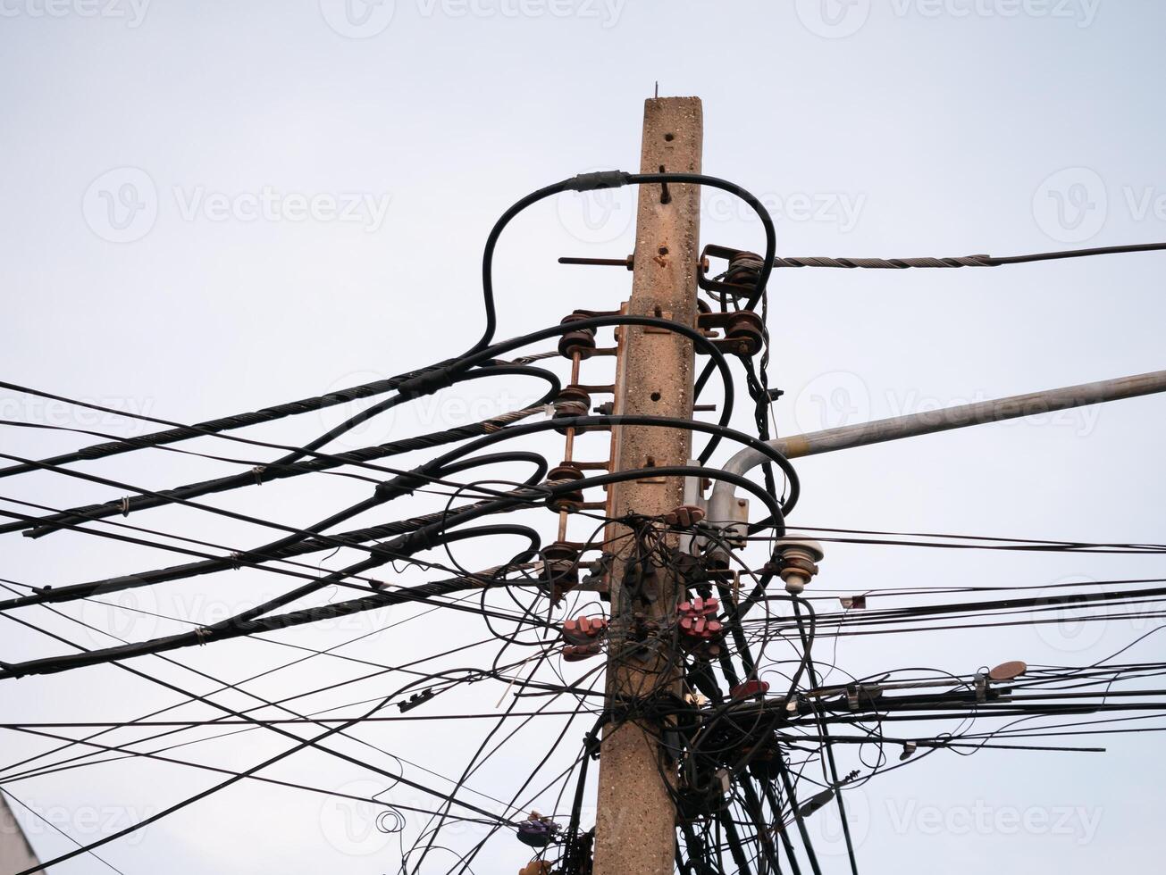 Power lines entwined urban streets infrastructure photography cityscape low angle energy connectivity photo