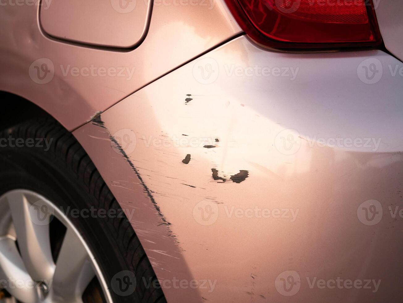 Car scratch repair urban parking lot photo daylight close-up vehicle maintenance tips