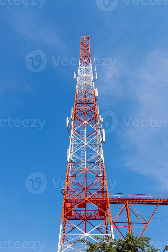 Telecommunication tower installation urban area technology infrastructure blue sky upward view connectivity enhancement photo