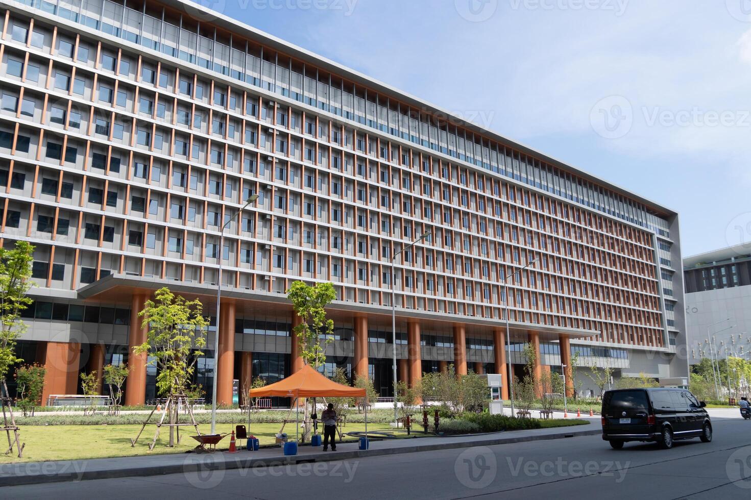 Exploring sustainable modern office building design in urban landscape with open space features photo