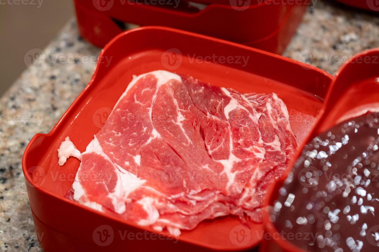 Sizzling meat preparation kitchen counter food photography domestic setting close-up view culinary artistry photo