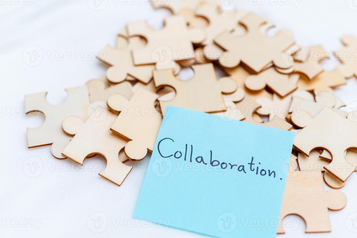 Collaboration in business strategy office setting puzzle pieces creative environment close-up teamwork concept for success photo