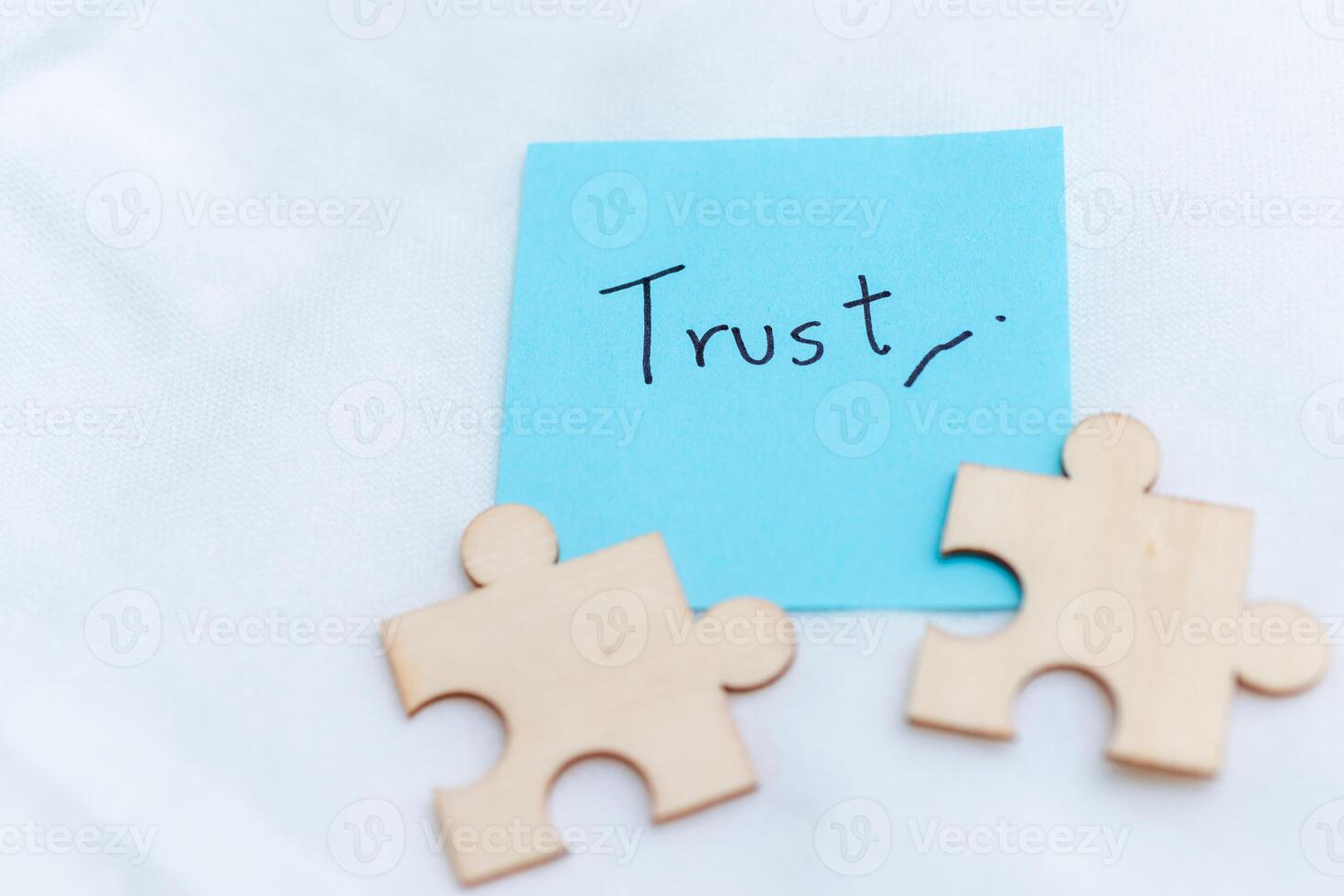 Building business trust puzzle pieces of partnership office space visual concept minimalist setting close-up view for effective collaboration photo