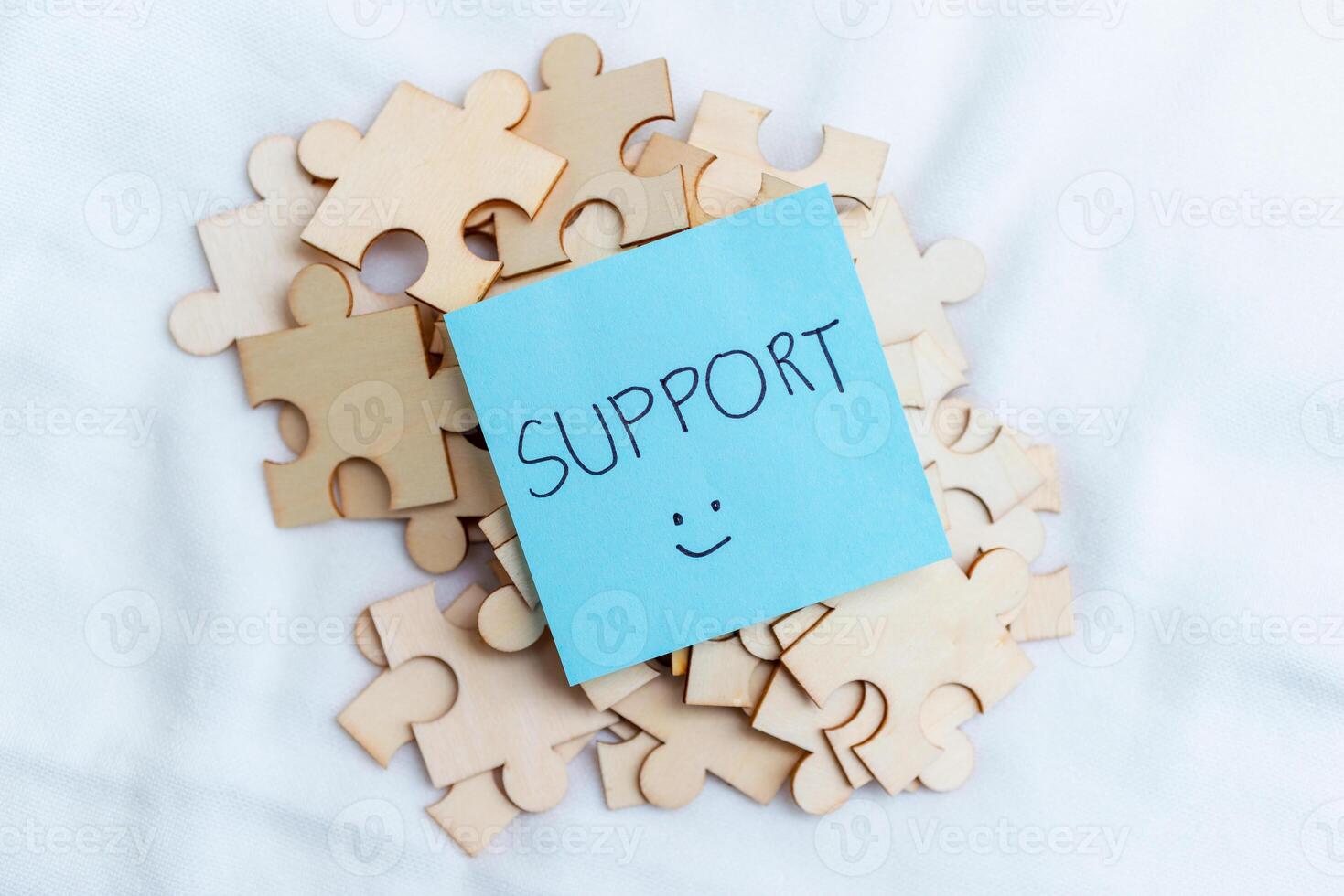 Supporting business growth puzzle pieces and collaboration workspace visual content creative environment close-up problem-solving concept photo